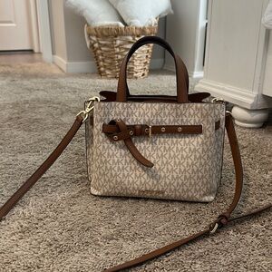 Michael kors small brown and cream colored purse with cross body strap